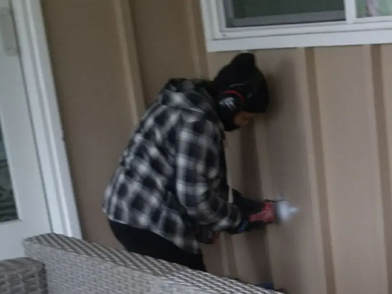 Professional electrician installing an exterior outlet in Hollister